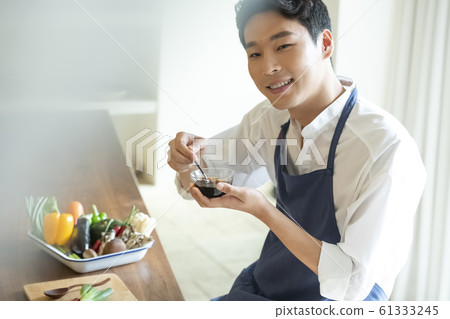 Man cooking Man cooking 61333245