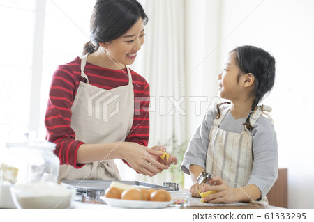 Girl baking cookies Girl baking cookies 61333295
