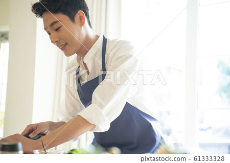 Man cooking Man cooking 61333328