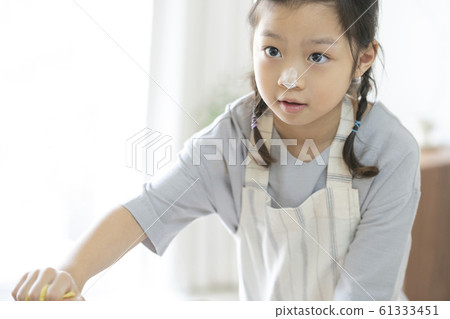 Girl baking cookies 61333451