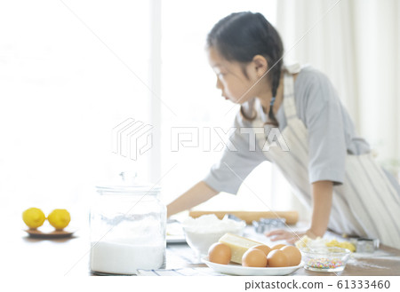 Girl baking cookies Girl baking cookies 61333460