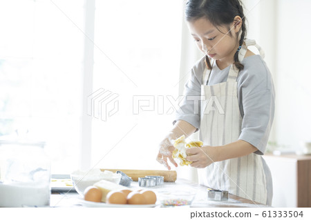 Girl baking cookies Girl baking cookies 61333504