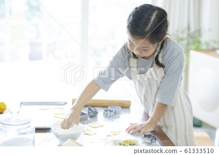 Girl baking cookies Girl baking cookies 61333510