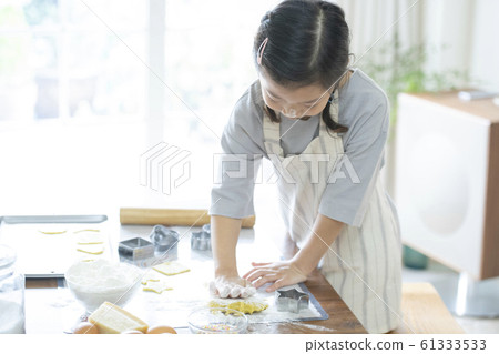 Girl baking cookies Girl baking cookies 61333533