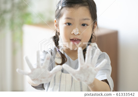 Girl baking cookies 61333542