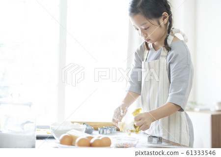 Girl baking cookies 61333546