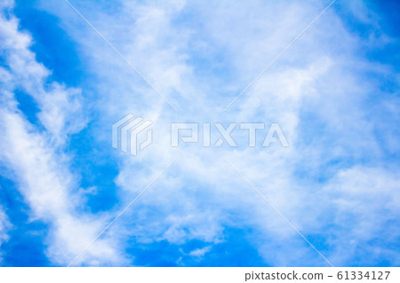 blue sky background with tiny clouds blue sky background with tiny clouds 61334127