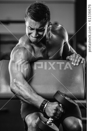 Handsome strong athletic men pumping up biceps 61336676