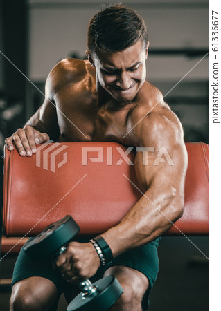Handsome strong athletic men pumping up biceps Handsome strong athletic men pumping up biceps 61336677