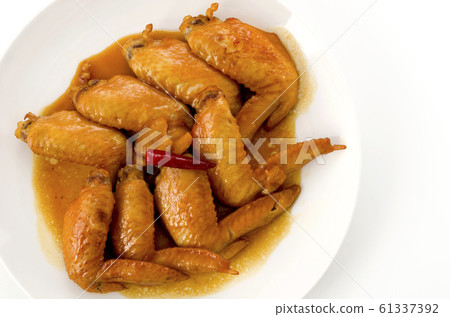 Sweet and spicy teriyaki chicken wings 61337392