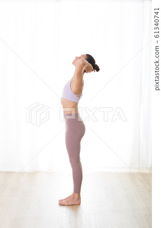 Portrait of gorgeous active sporty young woman practicing yoga in studio. Beautiful girl practice Pranayama breathing yoga pose. Healthy active lifestyle, working out in gym 61340741