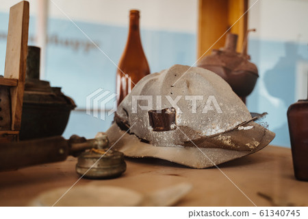 historic old helmet of diamond or gold mineworkers 61340745