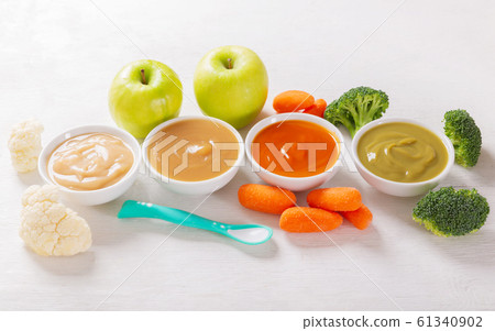 Baby food. Various kinds of bowls of fruit and 61340902