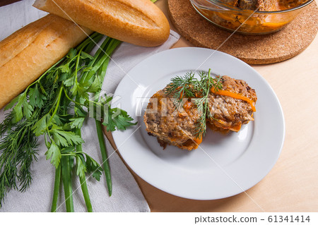 Rissole of pork served on a white plate with white 61341414