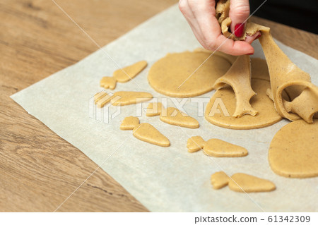 close up of female hands making cookies from fresh close up of female hands making cookies from fresh 61342309