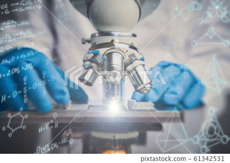 Close-up shot of microscope with metal lens at laboratory. Close-up shot of microscope with metal lens at laboratory. 61342531