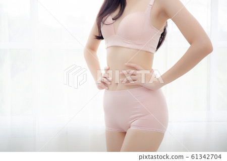 Closeup asian woman wear underwear beautiful body belly slim shape sexy with diet at room 61342704