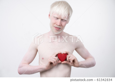 portrait of an albino man in studio dressed 61342834
