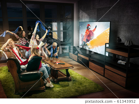 Group of friends watching TV, sport concept, leisure activity Group of friends watching TV, sport concept, leisure activity 61343952