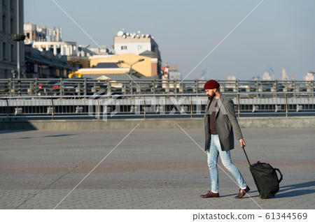 Adjust living in new city. Carry travel bag. Man Adjust living in new city. Carry travel bag. Man 61344569