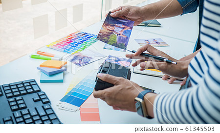 Advertising agency designer creative start-up team discussing ideas in office. 61345503