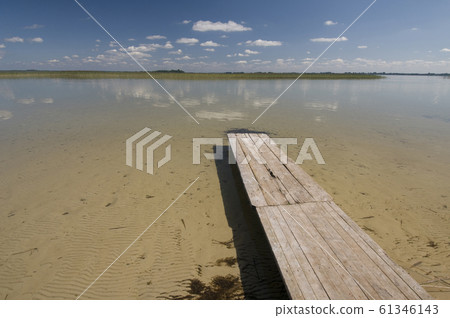 Transparent sand lake with wooden platform 61346143