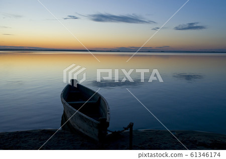 Sunrise... boat on lake 61346174