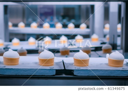 Ice cream automatic production line - conveyor belt with icecream cones 61349875