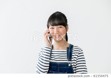 Elementary school girl smartphone Elementary school girl smartphone 61350475