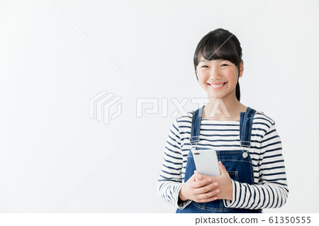 Elementary school girl smartphone Elementary school girl smartphone 61350555