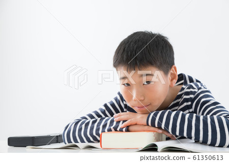 Primary schoolchild boy examination image 61350613