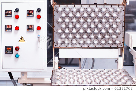 A modern form for baking nuts with condensed milk. Dessert manufacturing A modern form for baking nuts with condensed milk. Dessert manufacturing 61351762
