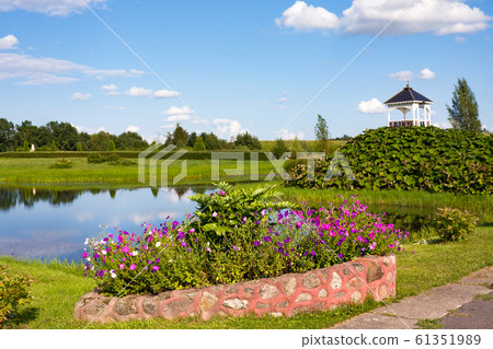 Park wih sculptures and pond near St. Anne's Church in Mosar, Belarus, the site of the Jesuit mission Park wih sculptures and pond near St. Anne's Church in Mosar, Belarus, the site of the Jesuit mission 61351989