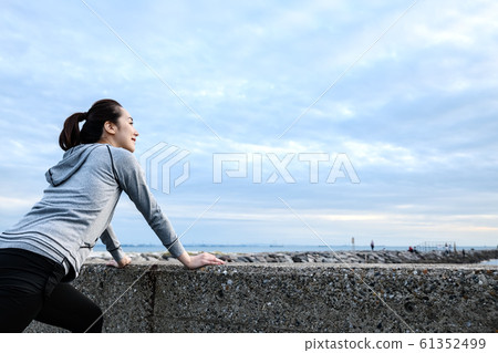 Runner running stretching woman jogging 61352499