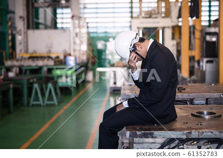 Stressed Factory manager owner crying Stressed Factory manager owner crying 61352783