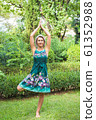 the girl practicing yoga and practicing yoga postures, amazing yoga postures in grass 61352988