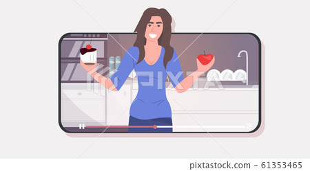 woman blogger holding sweet cake and apple fruit girl choosing trying to resist temptation recording online video blogging weight loss diet concept smartphone screen mobile app portrait horizontal 61353465