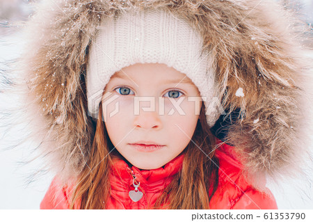Portrait of little adorable girl in snow sunny winter day Portrait of little adorable girl in snow sunny winter day 61353790