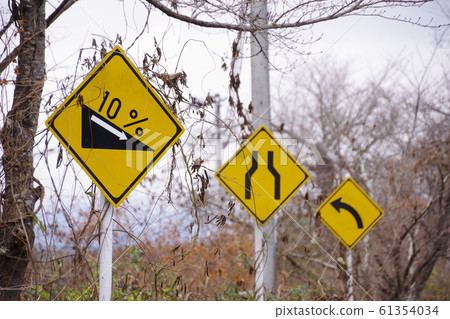 Signs seen on mountain roads Warning signs Signs seen on mountain roads Warning signs 61354034