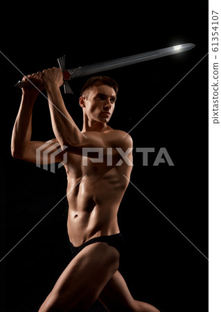 Warrior fight with sword isolated on black. Warrior fight with sword isolated on black. 61354107