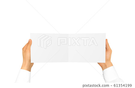 Hand in white shirt sleeve holding blank booklet card in the han 61354199