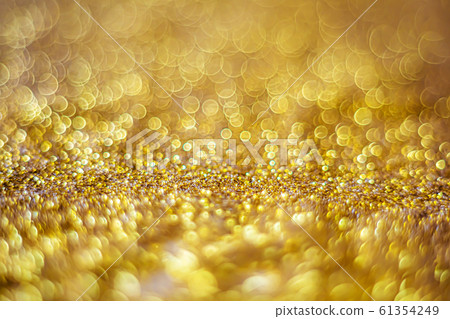 Glitter light abstract gold bokeh blurred Glitter light abstract gold bokeh blurred 61354249