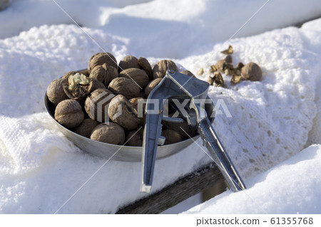 winter flat lay with walnut, Nutcracker, white winter flat lay with walnut, Nutcracker, white 61355768
