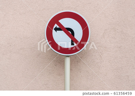 no left turn traffic sign against wall with copy 61356459