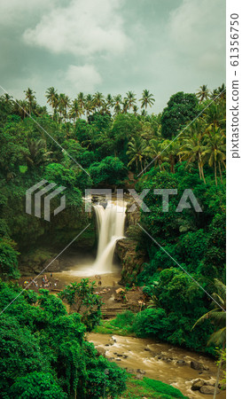 Tegenungan Waterfall. Ubud in Bali, Indonesia. Vertical orientation Tegenungan Waterfall. Ubud in Bali, Indonesia. Vertical orientation 61356750