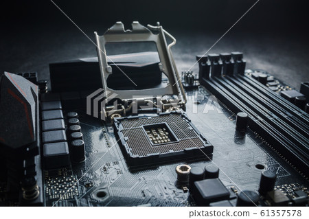 Close-Up of CPU Socket on a Modern Computer Motherboard. Electronic Small Component Details. PC repair or upgrade concept. Close-Up of CPU Socket on a Modern Computer Motherboard. Electronic Small Component Details. PC repair or upgrade concept. 61357578