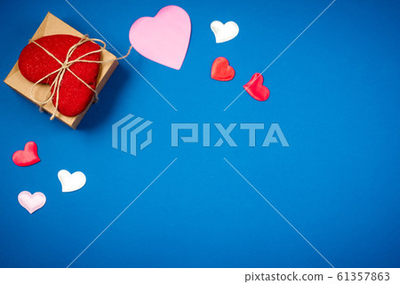Red heart with a gift for Valentine's Day 61357863