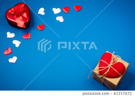 Red heart with a gift for Valentine's Day 61357872