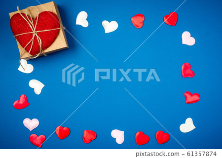 Red heart with a gift for Valentine's Day 61357874