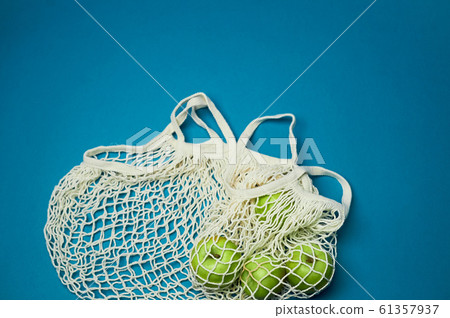 Avoska, mesh with apples. Replacing plastic bags. Taking care of the environment. Healthy eating. Avoska, mesh with apples. Replacing plastic bags. Taking care of the environment. Healthy eating. 61357937